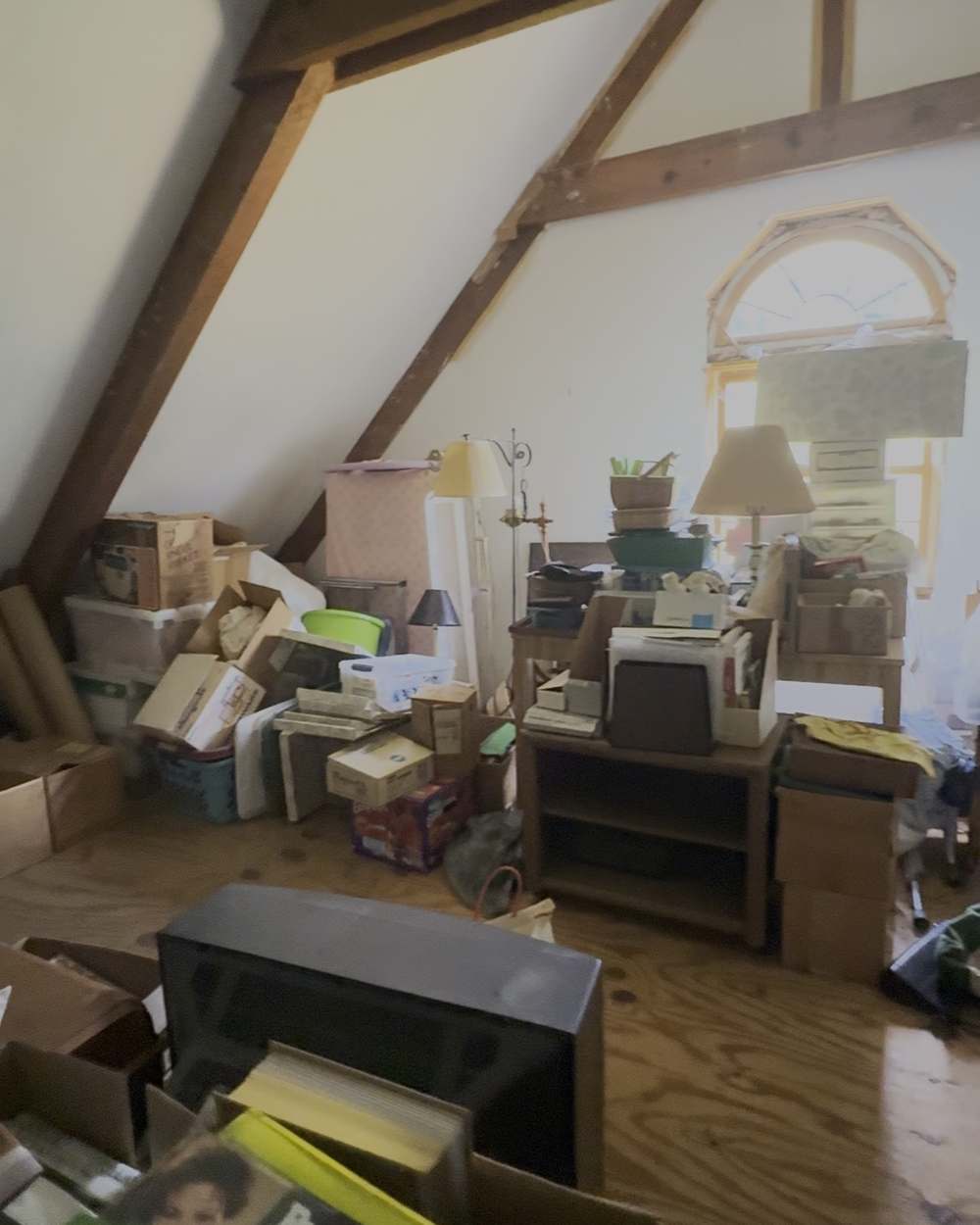 Attic of the Marstons Mills house with the family's belongings still in it